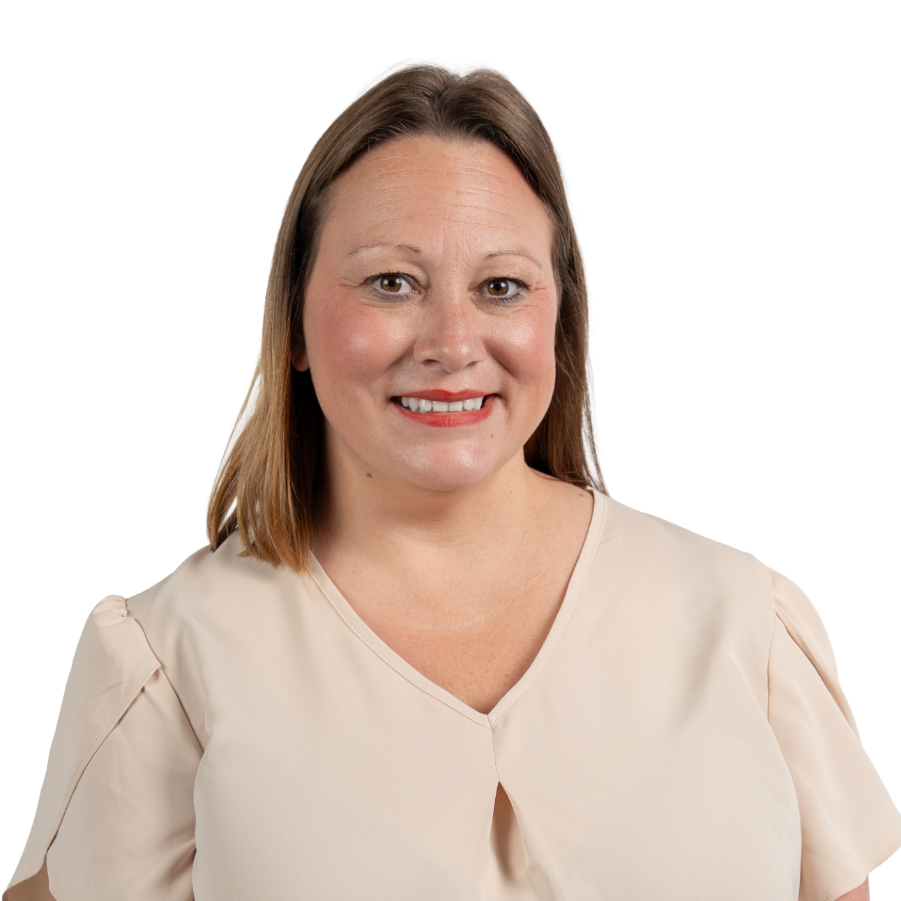 A woman wearing hoop earrings and a white shirt is smiling for the camera.