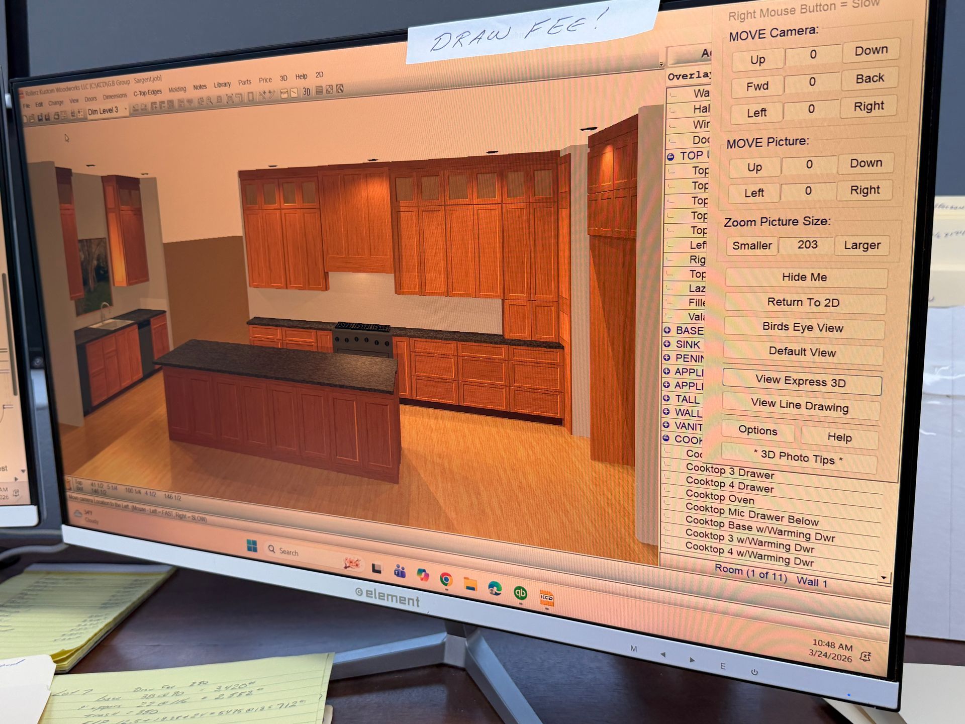 Computer screen showing a 3D kitchen design model with cabinets and countertops