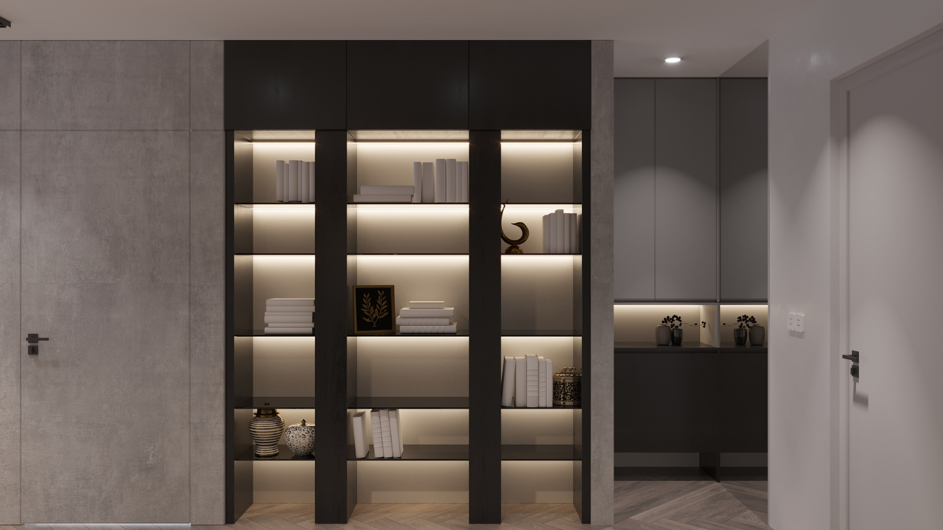 Built-in black bookshelves with interior lighting and various decorative items. Grey walls and doors on either side.