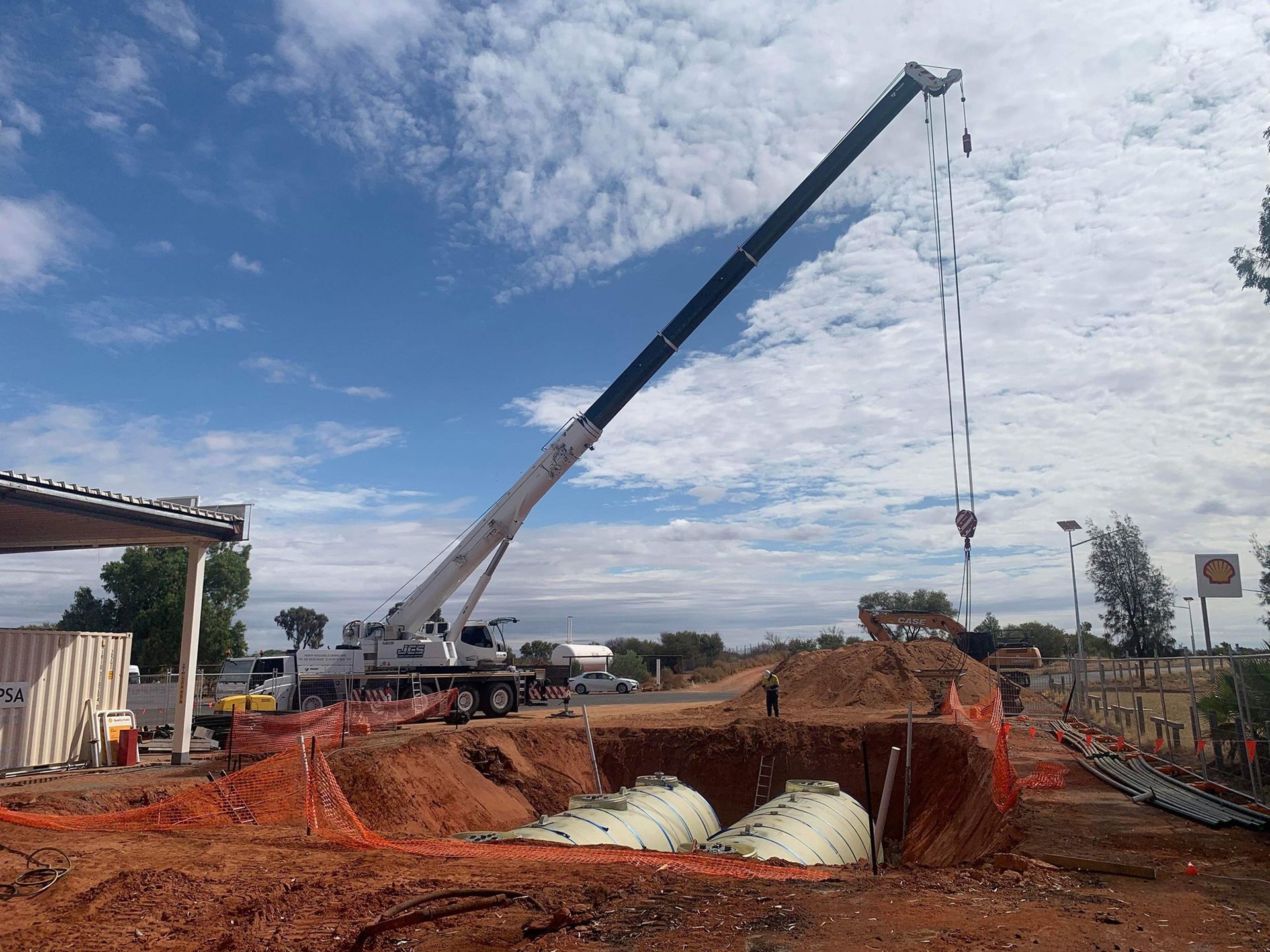 A large crane is working on a construction site