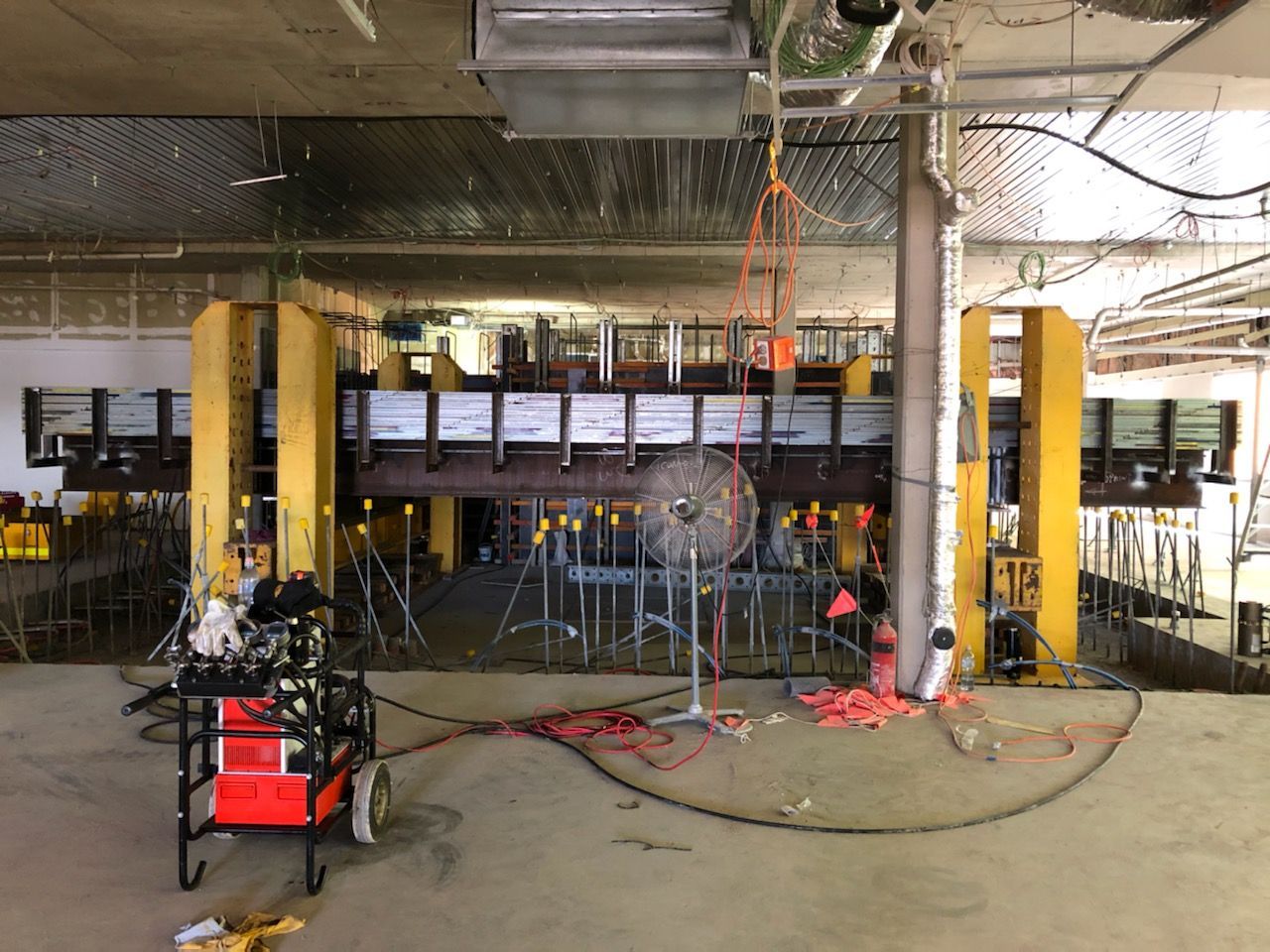 A large room with a lot of wires hanging from the ceiling.