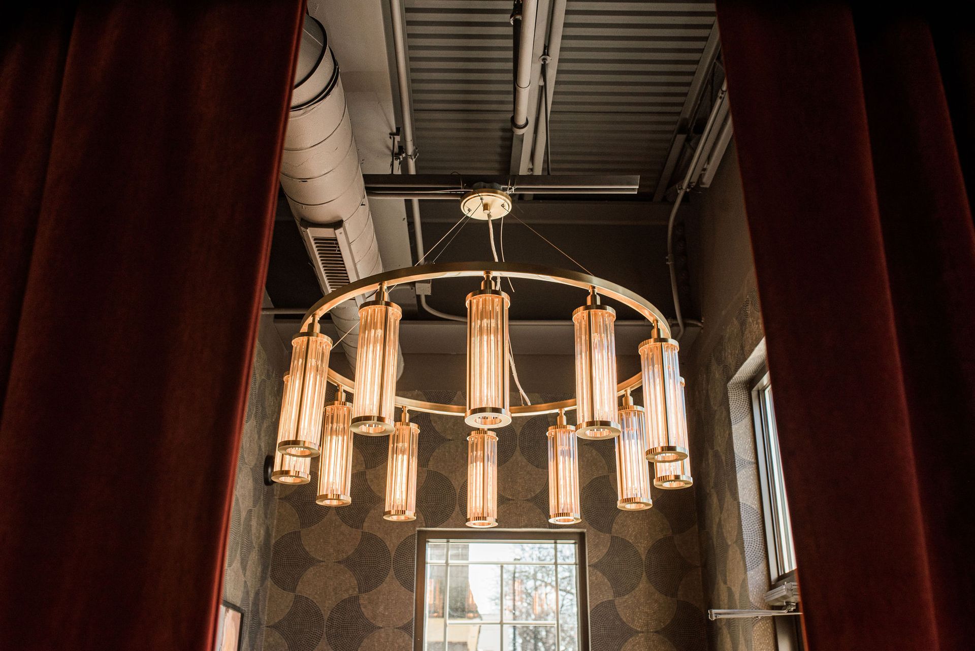 A large chandelier is hanging from the ceiling in a room.