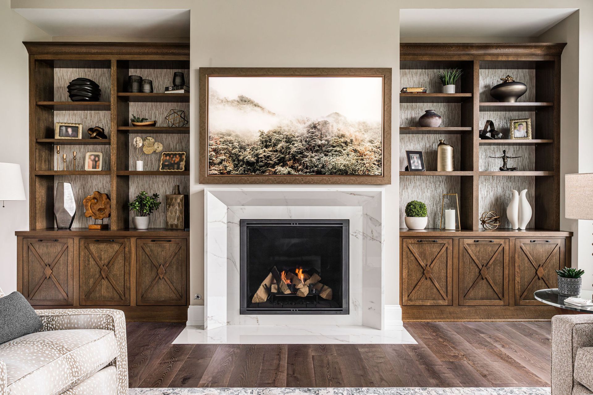 A living room with a fireplace and a television.