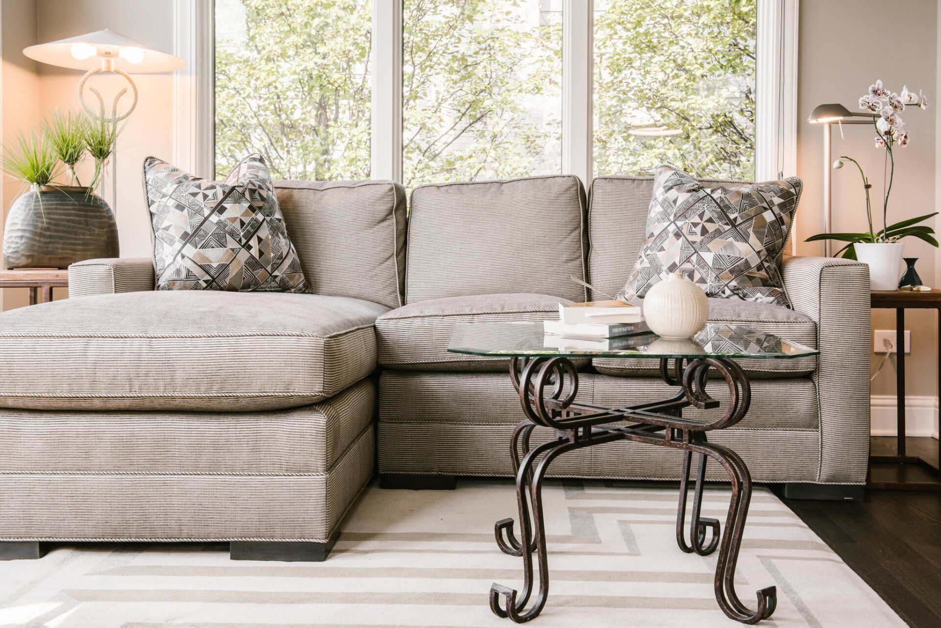 A living room with a sectional couch and a coffee table.