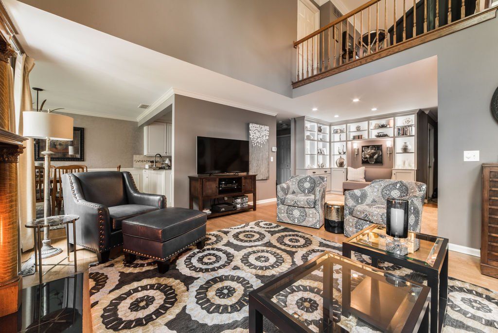 A living room filled with furniture and a fireplace.