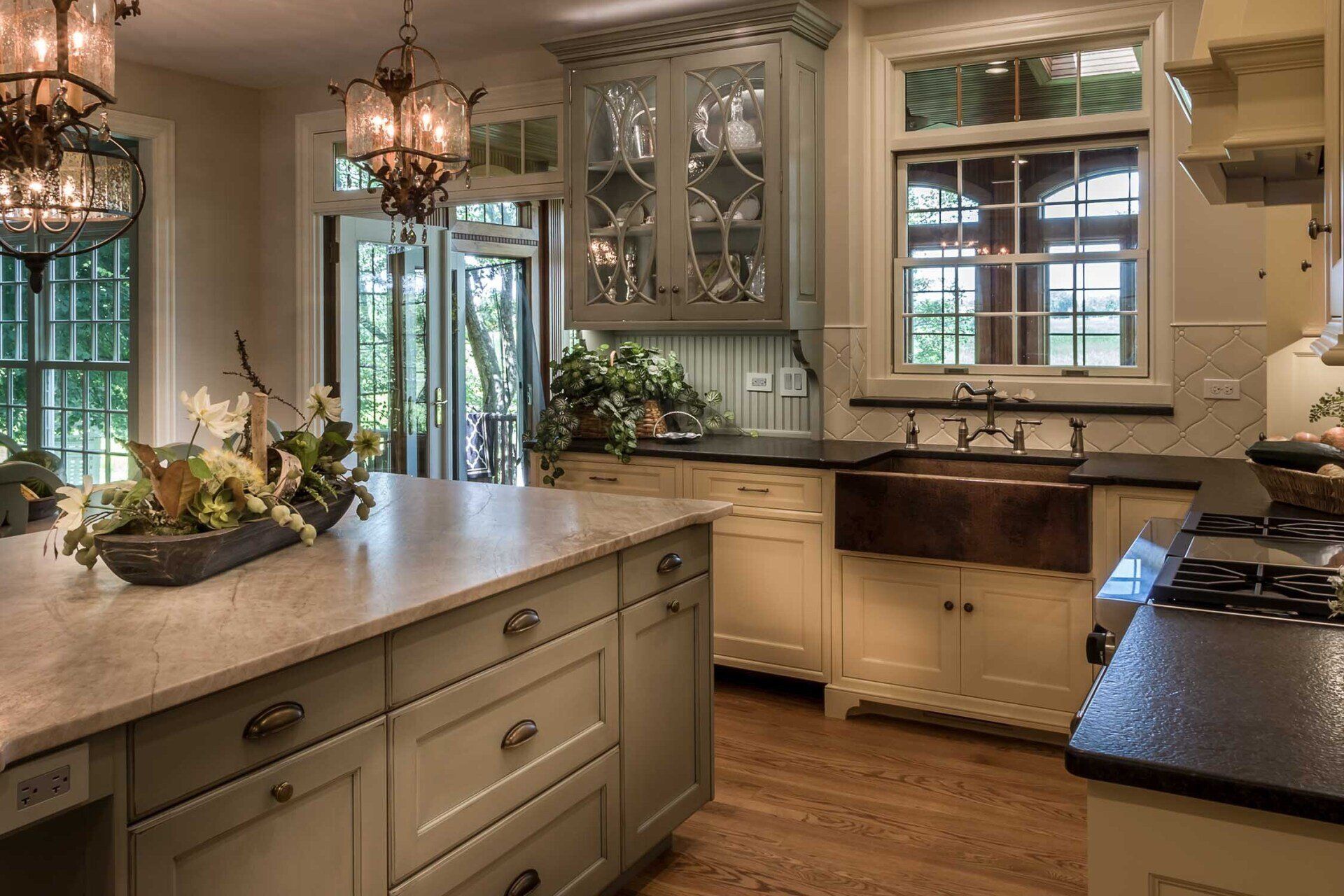 A kitchen with a large island and a sink