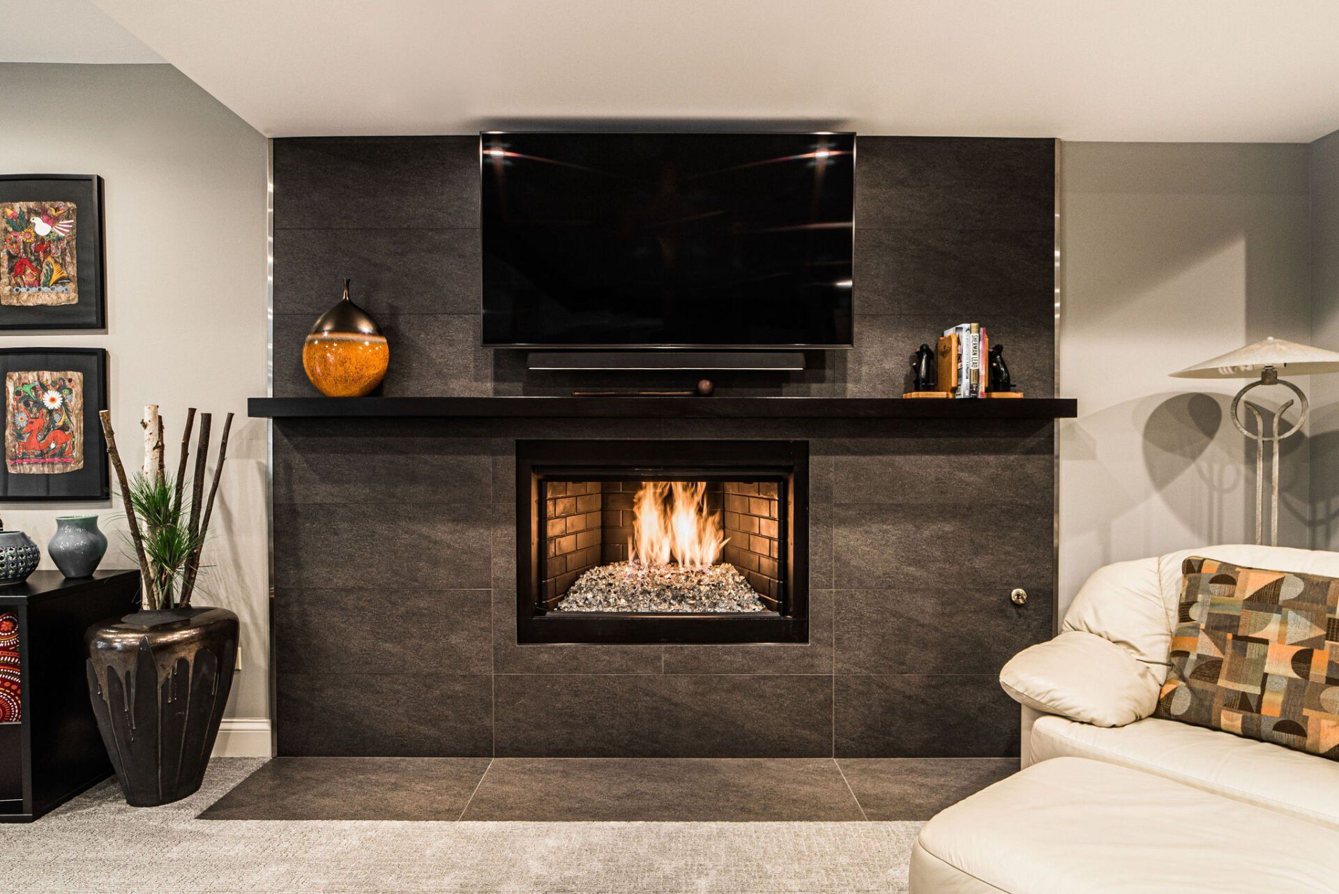 A living room with a fireplace and a flat screen tv.