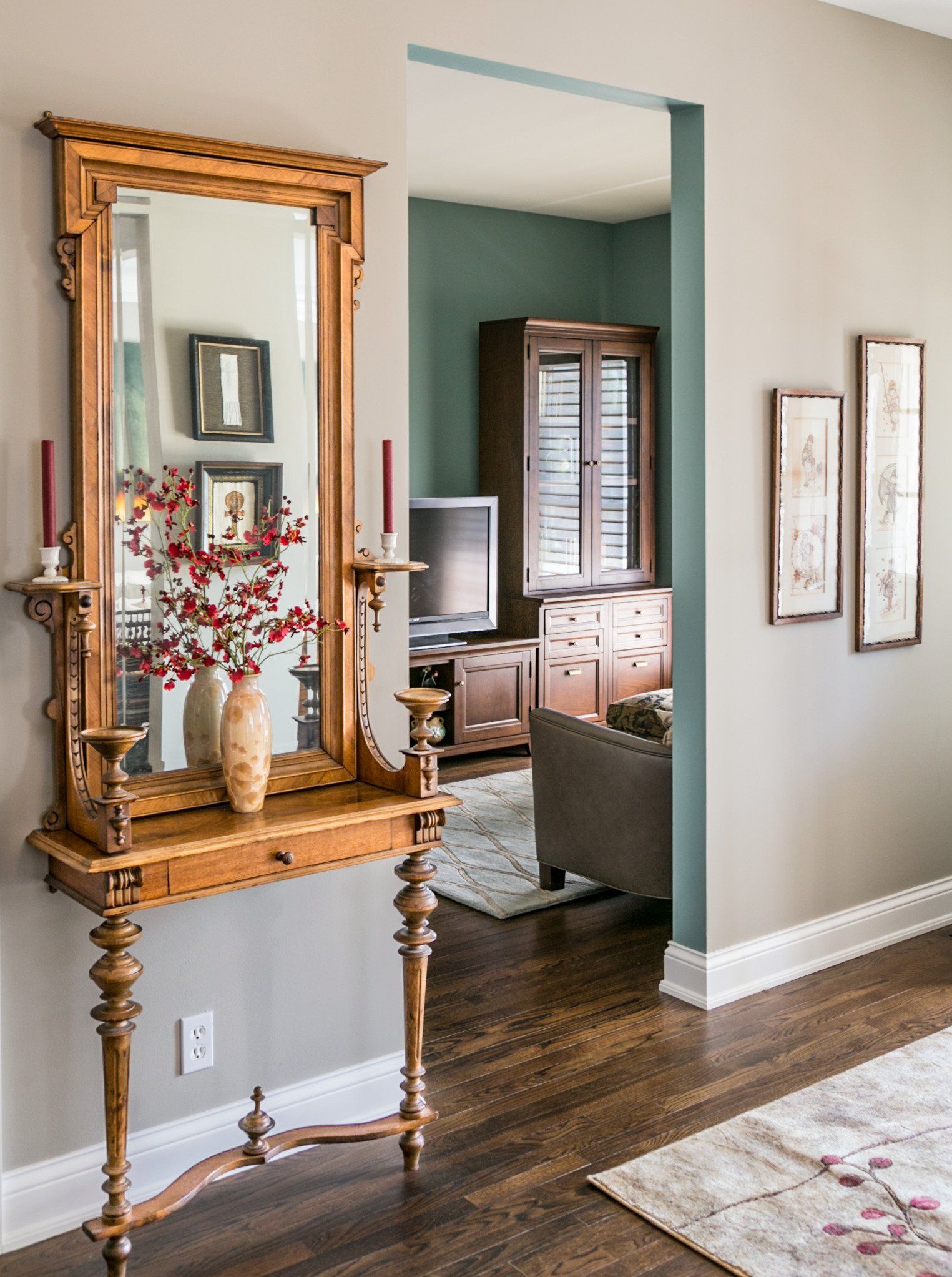 A wooden table with a mirror on top of it in a living room.