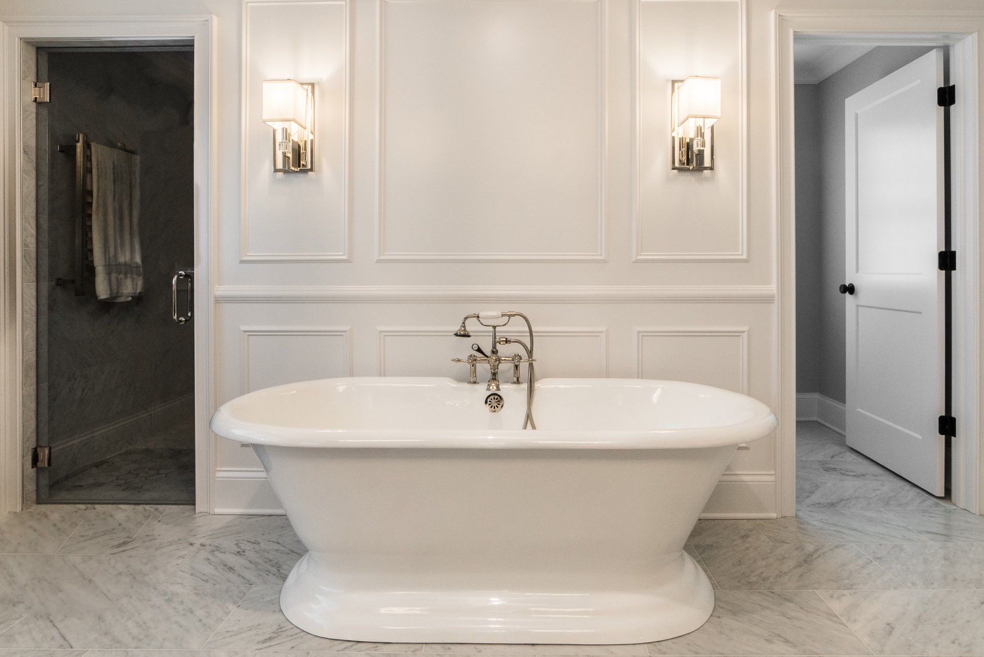 There is a bathtub in the middle of the bathroom.