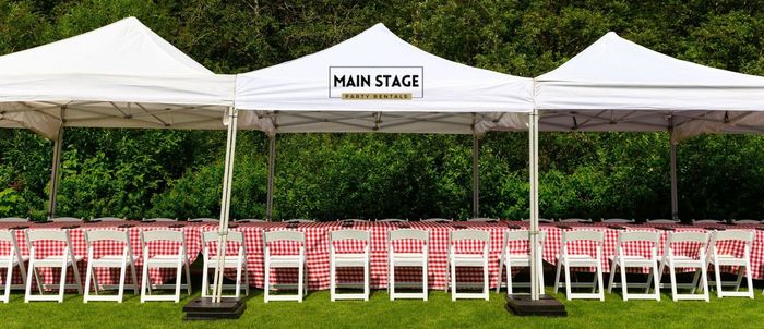 Our setup of tents, tables, and chairs for a Houston school reunion