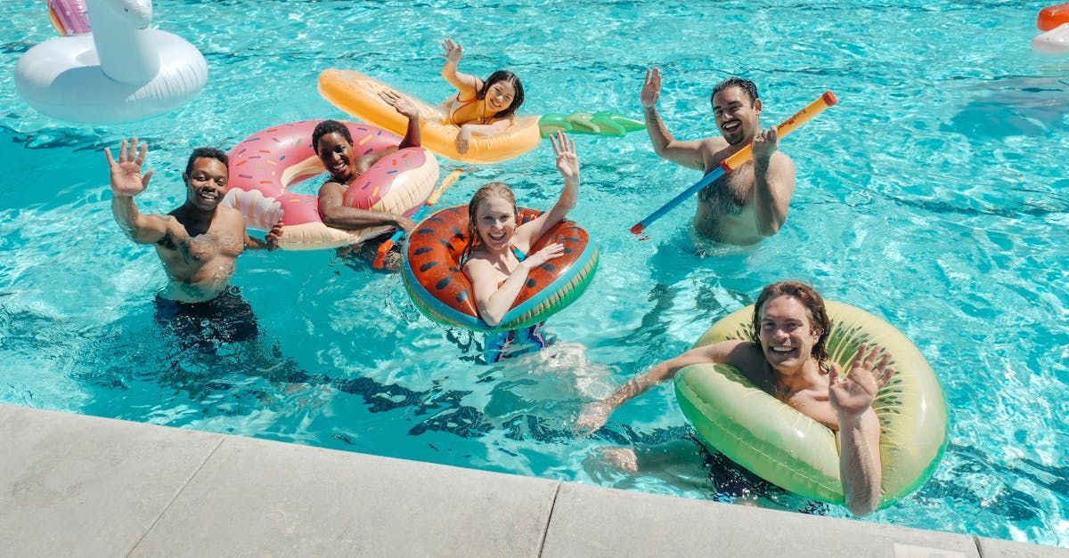 A group of people are floating on rafts in a swimming pool.