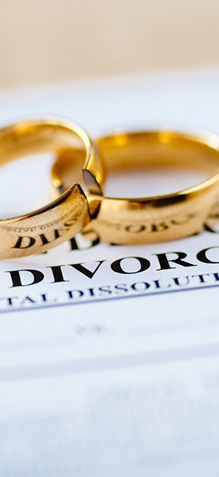 Divorce Paper And A Set Of Gold Wedding Rings — Law Firm in Taree, NSW