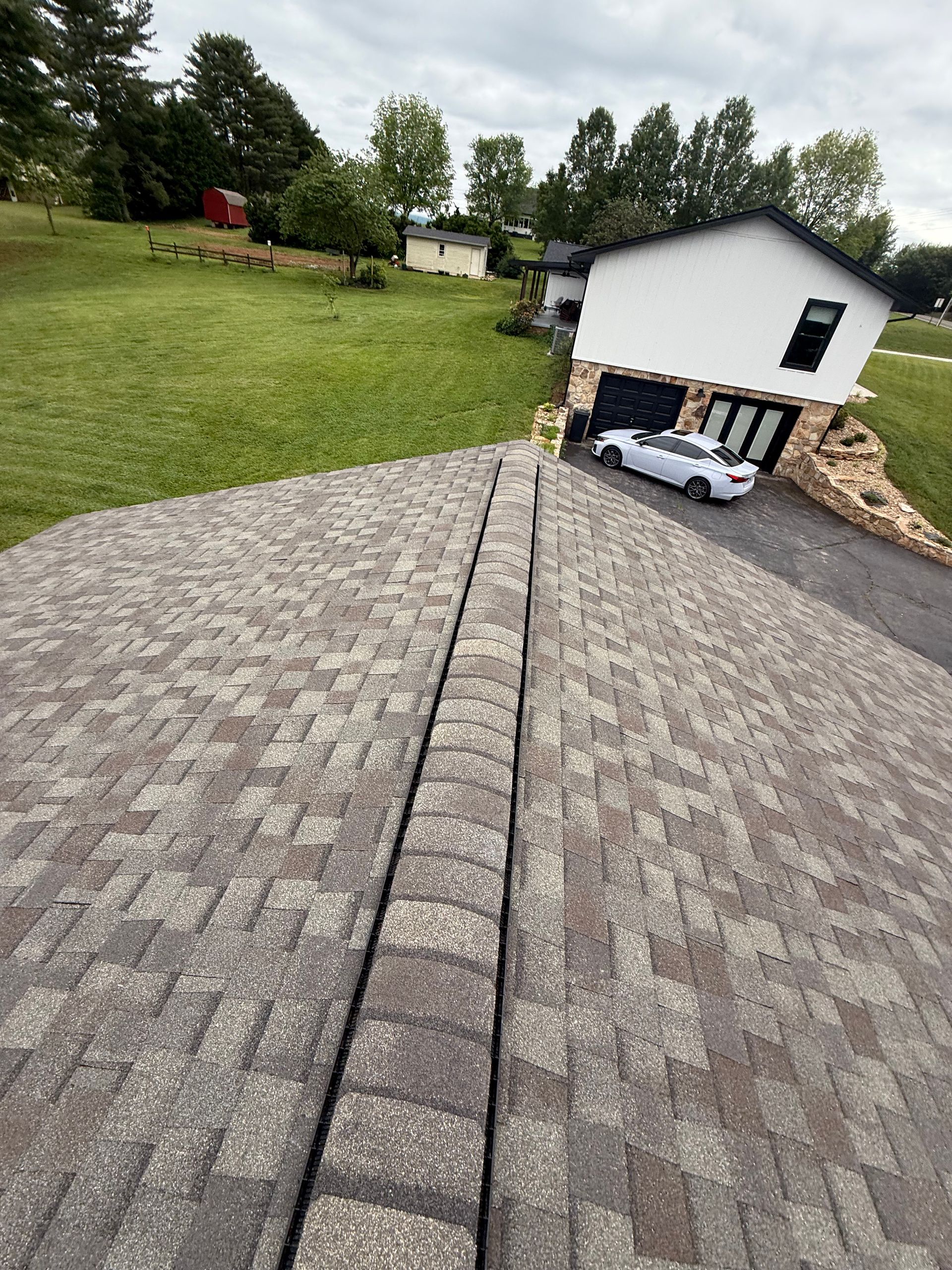 A car is parked on the roof of a house.