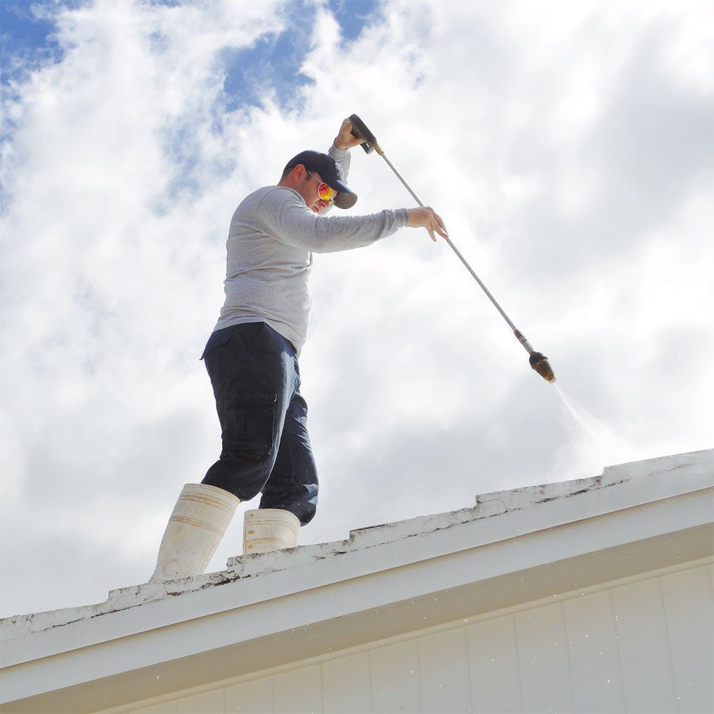 A Man Cleaning The Roof — Springfield, IL — Midwest Power/Soft Washing