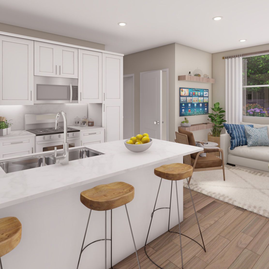Modern kitchen and living area with white cabinets, island with stools, and couch.