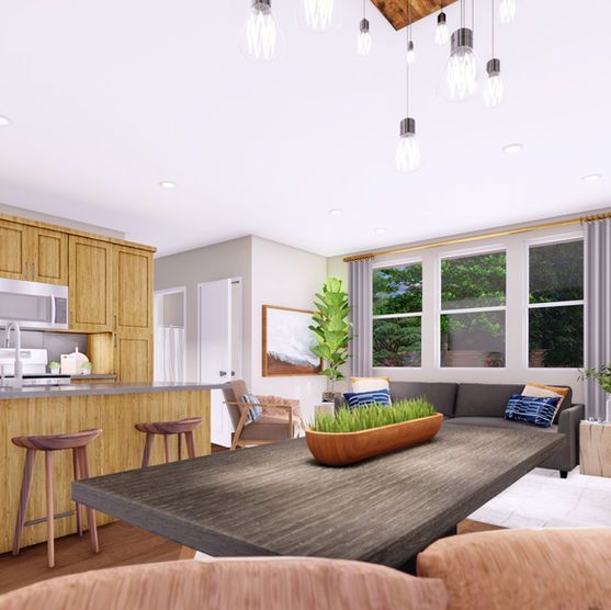 Open-concept dining and kitchen. Wood table and cabinets. Modern lighting, large windows, and gray sofa.