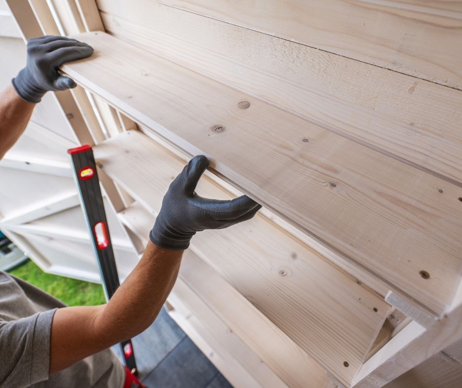 A professional builder creating custom shelving