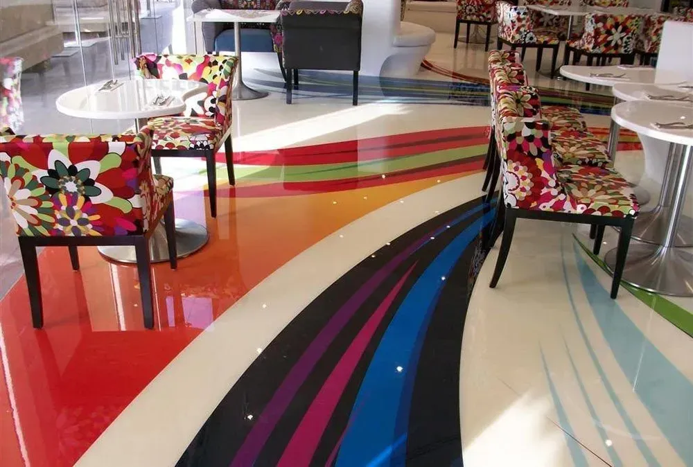 A Room with Tables and Chairs and A Colourful Floor — Concrete Colour Solutions in Morisset, NSW