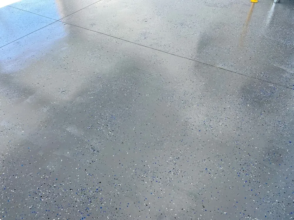 Shiny Gray Epoxy Garage Floor With Colored Flecks