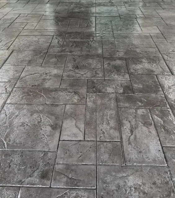 A black and white photo of a brick floor Concrete — Concrete Colour Solutions in Morisset, NSW