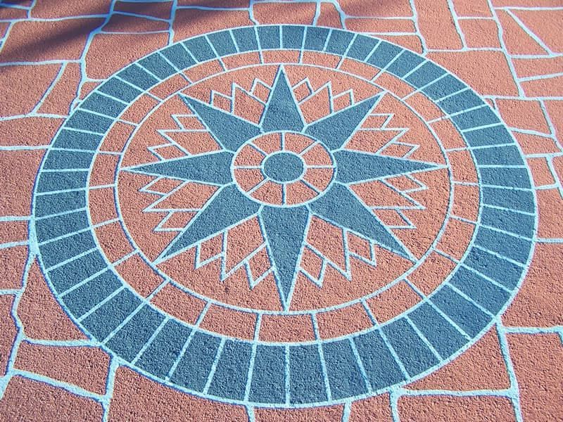 A Circular Pattern on A Brick Floor with A Star in The Center — Concrete Colour Solutions in Morisset, NSW