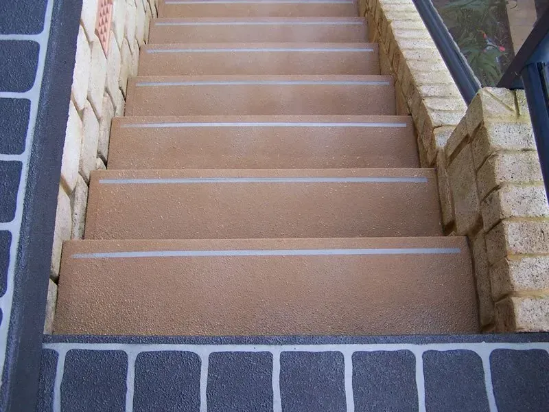 A set of stairs leading up to a brick wall — Concrete Colour Solutions in Morisset, NSW