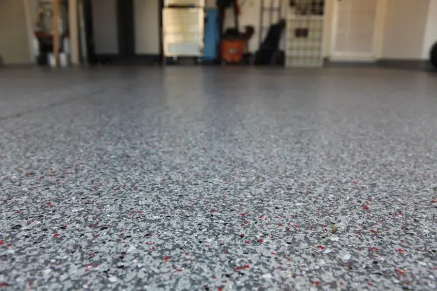 A close up of a concrete floor in a garage. — Concrete Colour Solutions in Morisset, NSW
