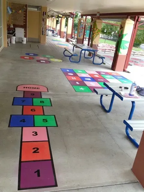 A colourful hopscotch game is painted on the floor — Concrete Colour Solutions in Morisset, NSW