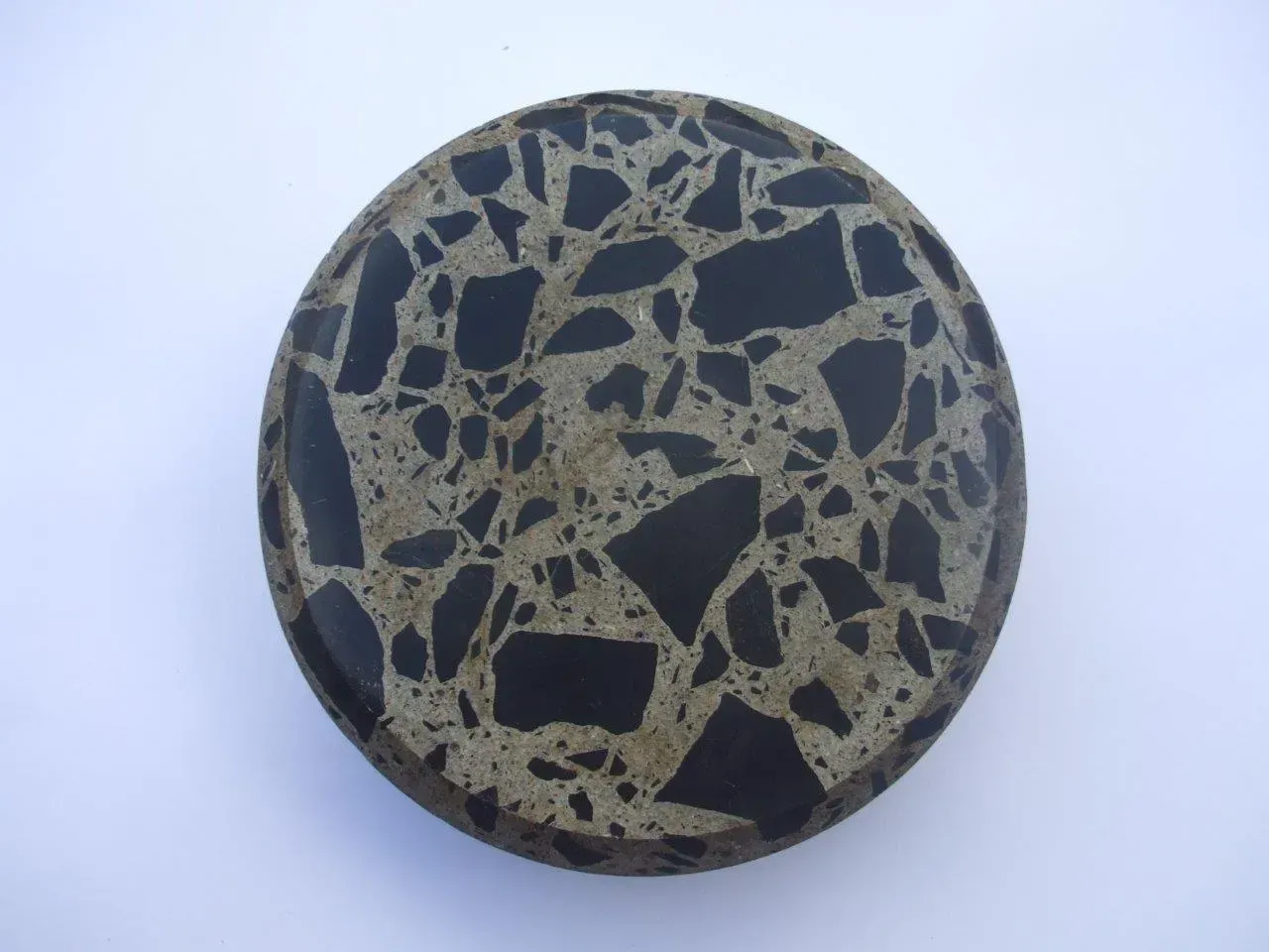 A circular object with a black and white pattern on it — Concrete Colour Solutions in Morisset, NSW