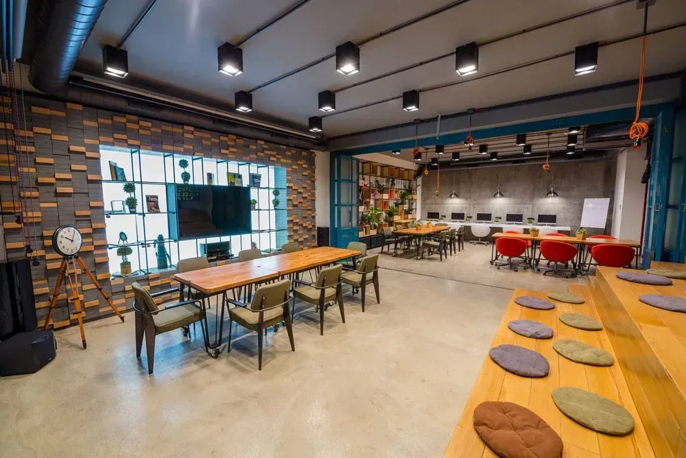 A Large Room with Tables and Chairs in It — Concrete Colour Solutions in Morisset, NSW