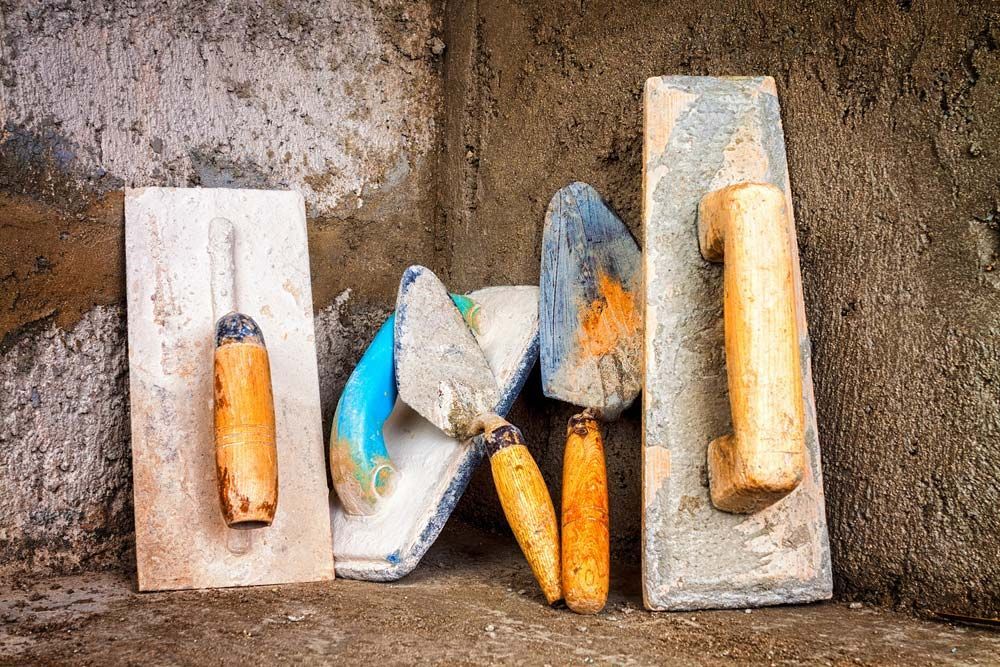 A Group of Construction Tools Sitting on Top of A Concrete Surface — Concrete Colour Solutions in Morisset, NSW