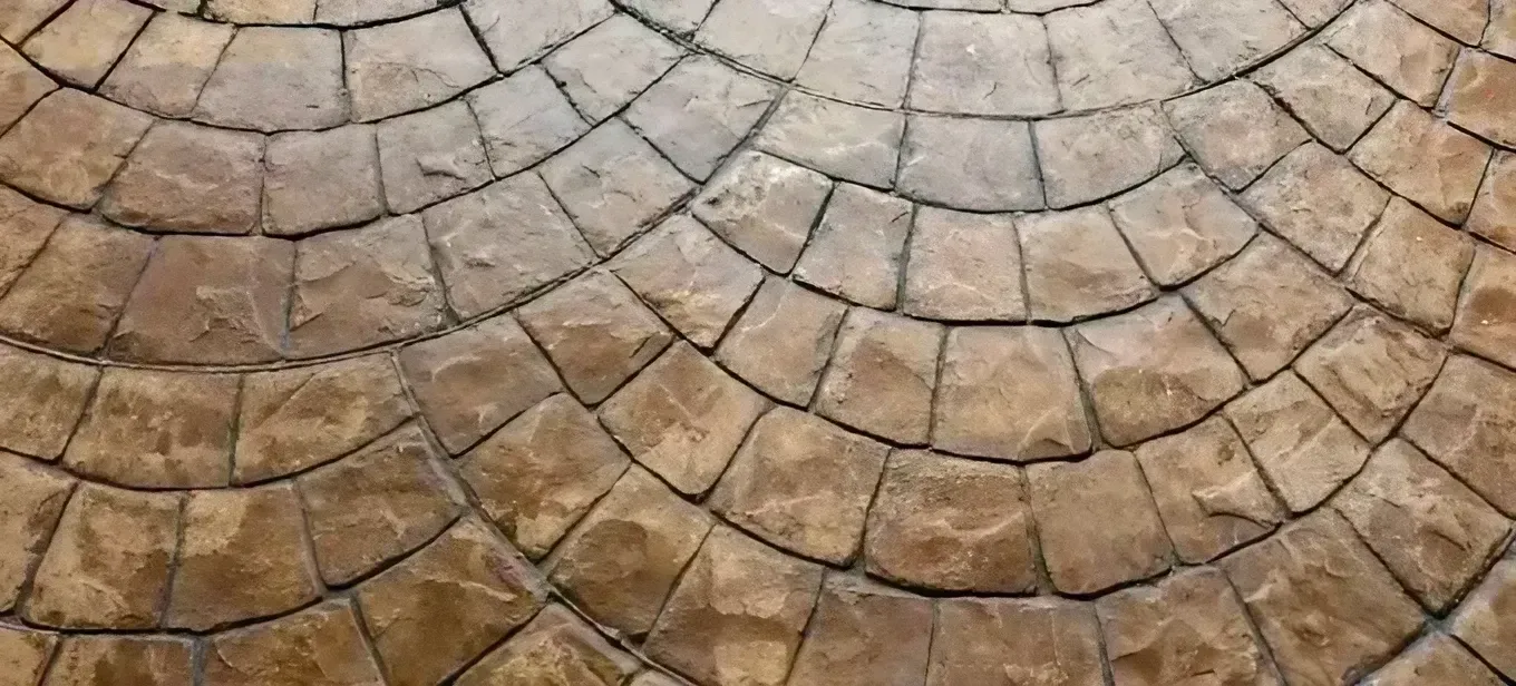 A Close up Of a Circular Pattern on A Brick Floor — Concrete Colour Solutions in Morisset, NSW