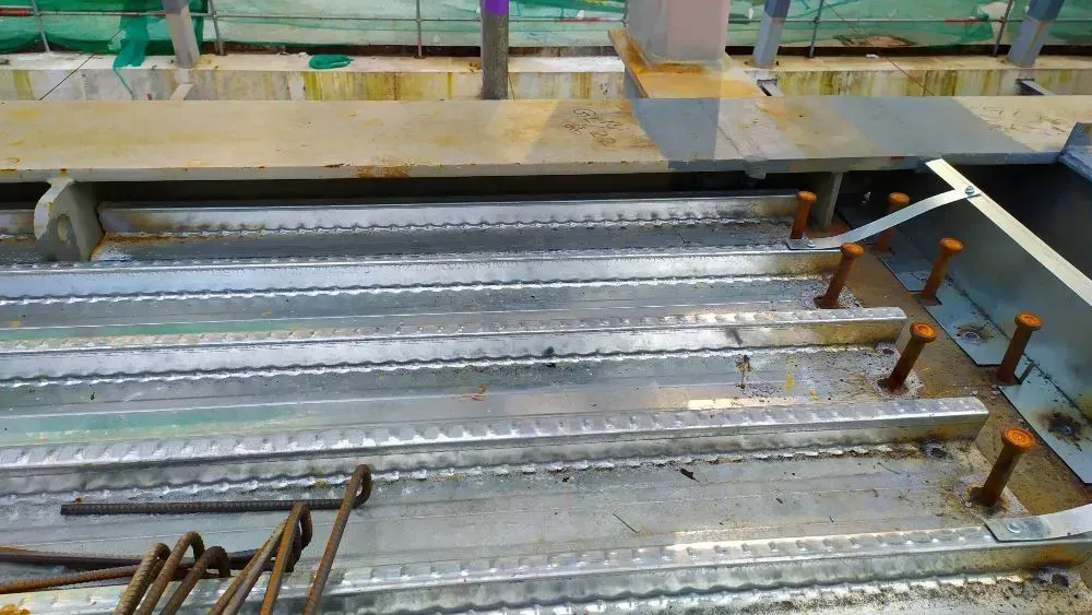 A Close up Of a Metal Structure with Screws in It — Concrete Colour Solutions in Morisset, NSW