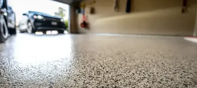 A Car Is Parked in A Garage with A Concrete Floor — Concrete Colour Solutions in Morisset, NSW