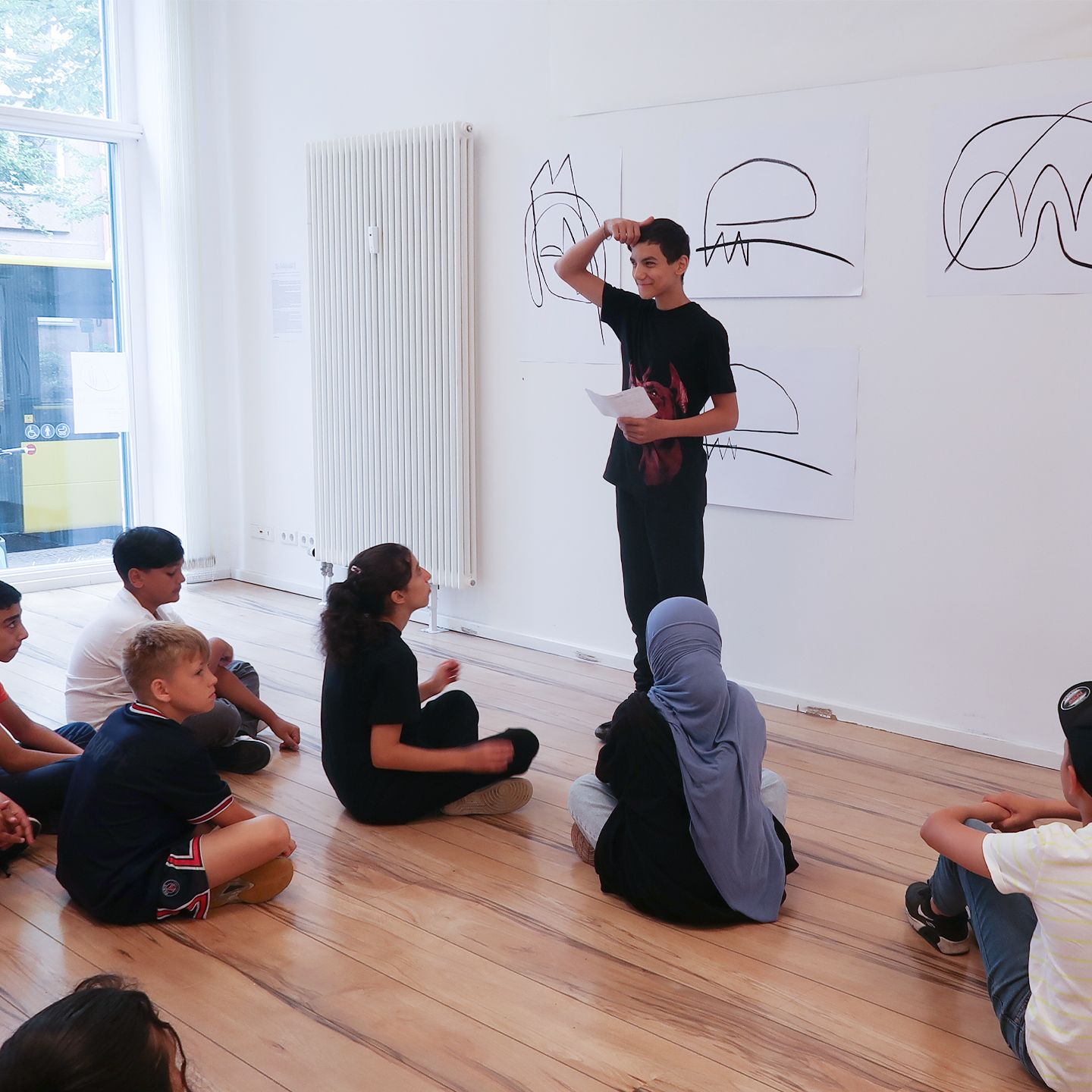 Boy talks about his work of art and inspirations.