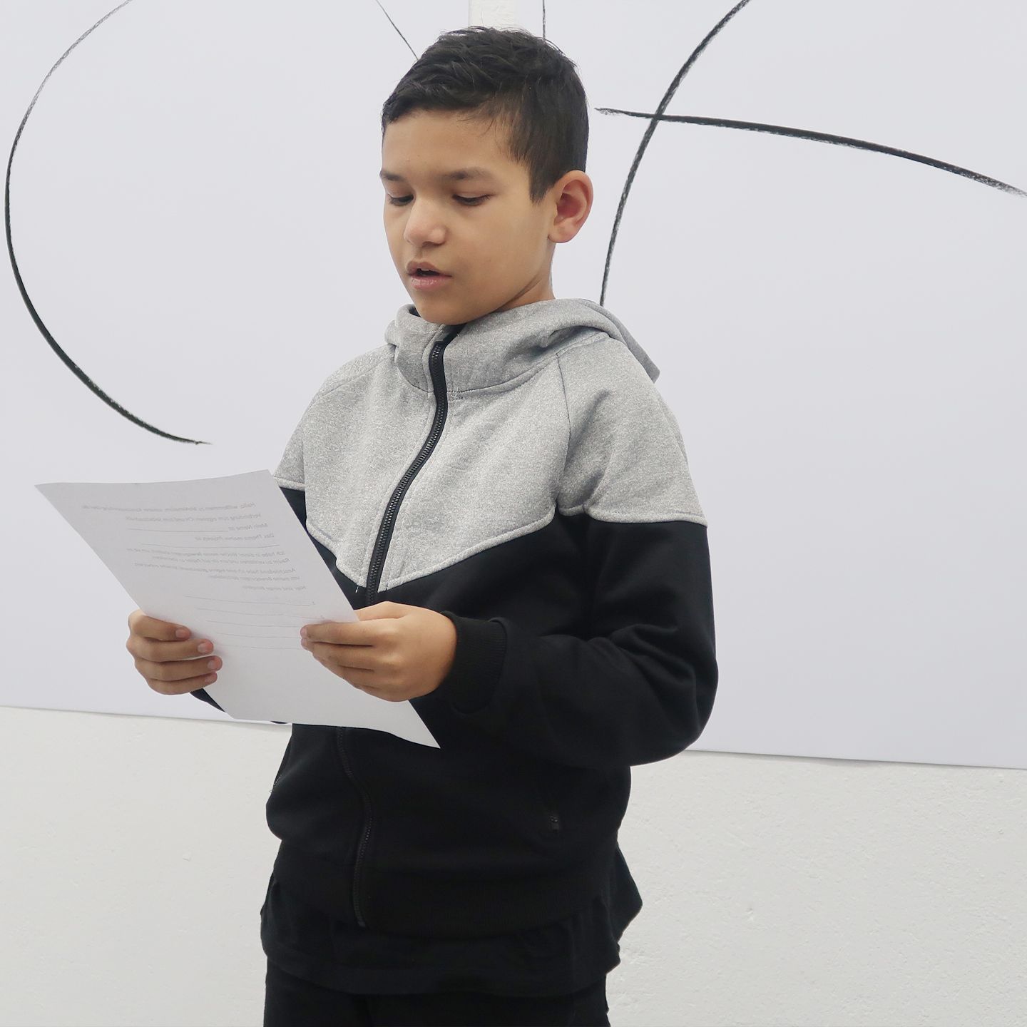 Boy describes his artistic creations.