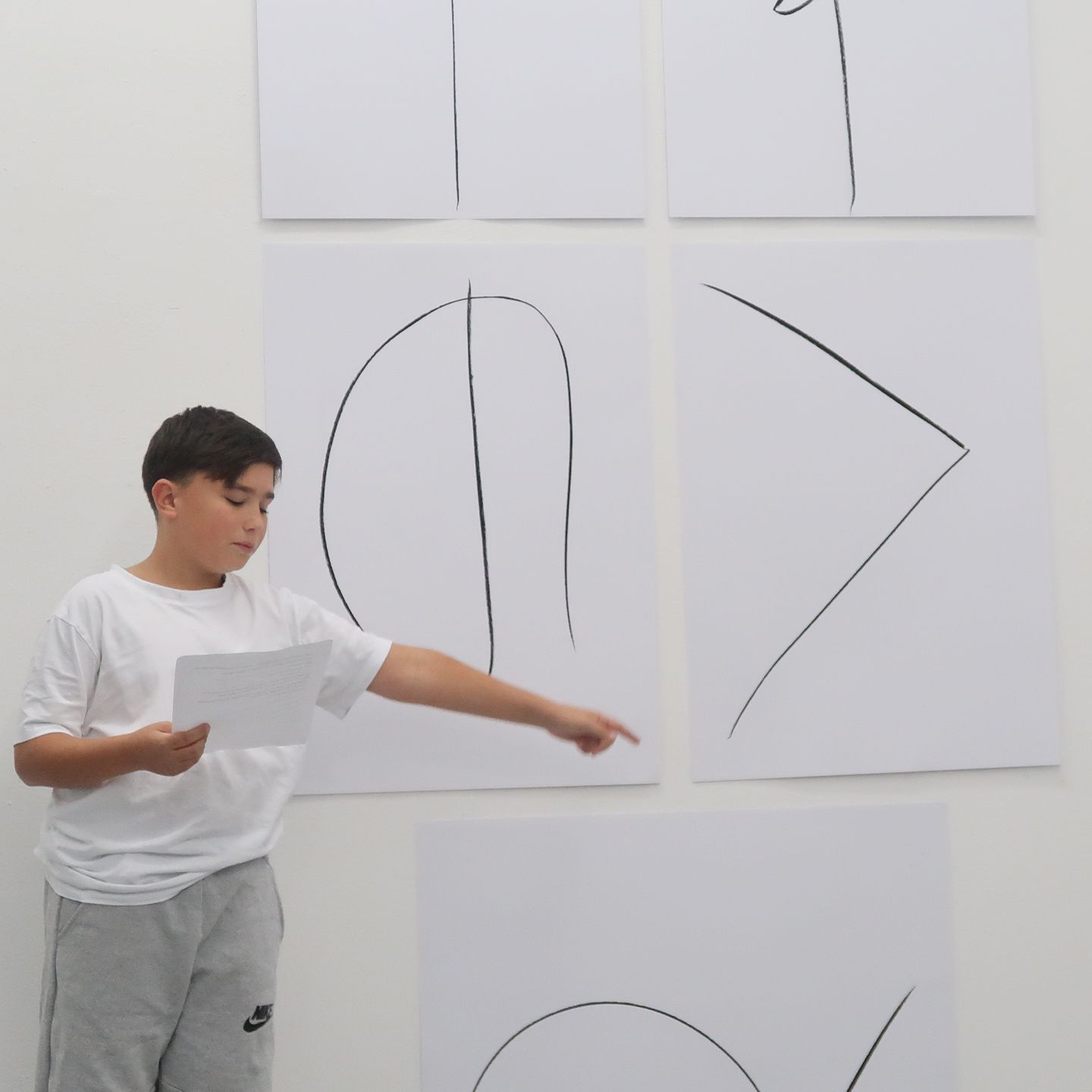 Boy at hi final art presentation.