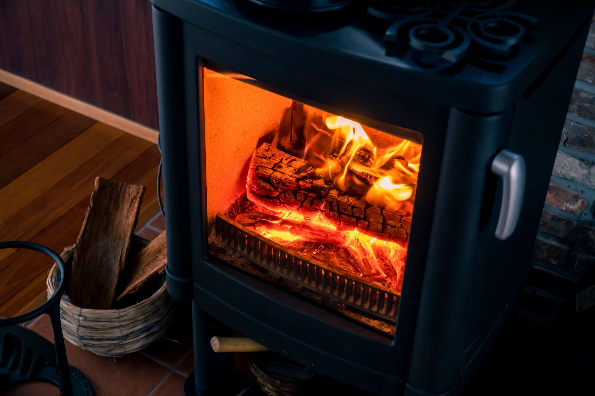 A Wood-burning Stove With a Glowing Fire Behind Glass — The Flue Pro In Huntingfield, TAS