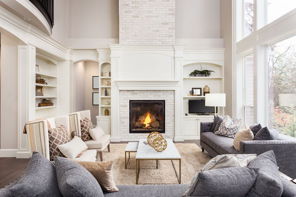 A Bright, Modern Living Room Featuring a Tall, White Brick Fireplace — The Flue Pro In Huntingfield, TAS