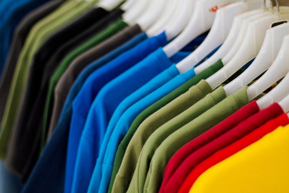 t-shirt in row on hanger.
