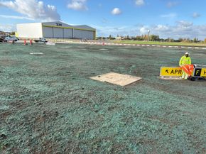 John Deere tractor with stone burier preparing seedbed for conventional seeding