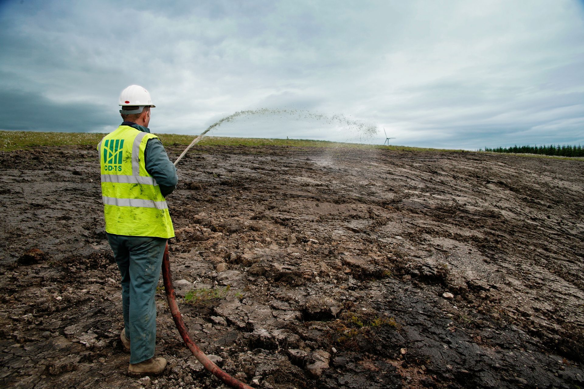Hydroseeding, hose work, at Clyde Wind Farm in Scotland.