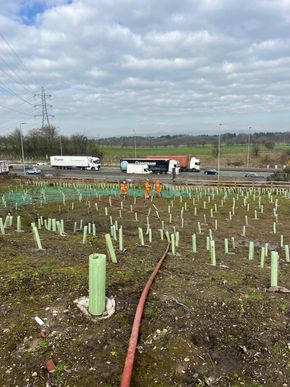 John Deere tractor with stone burier preparing seedbed for conventional seeding