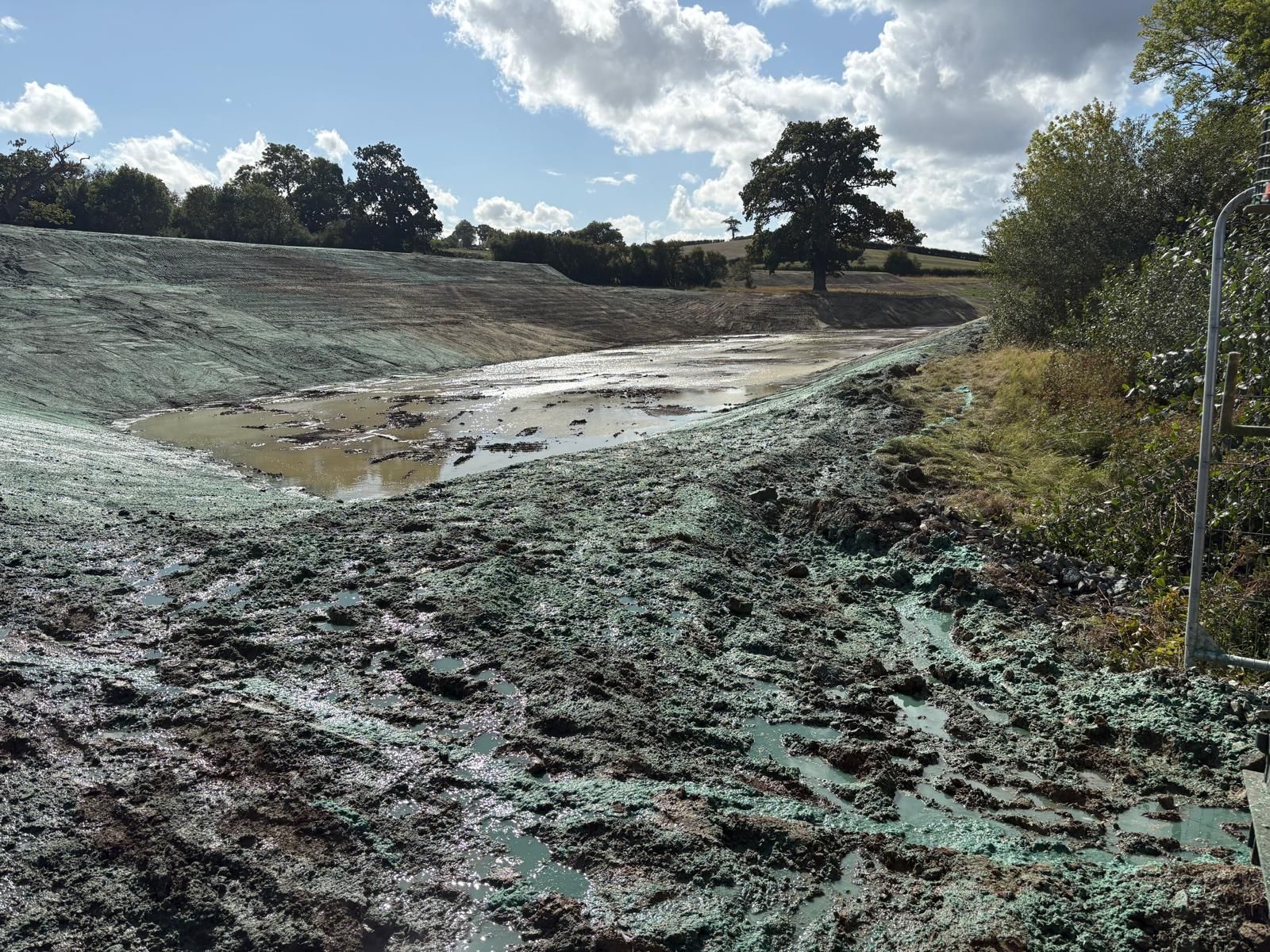 CDTS's largest hydroseeder, a 6,000-litre Finn lorry-mounted unit, applying hydraulic seeding mulch to a steep embankment.