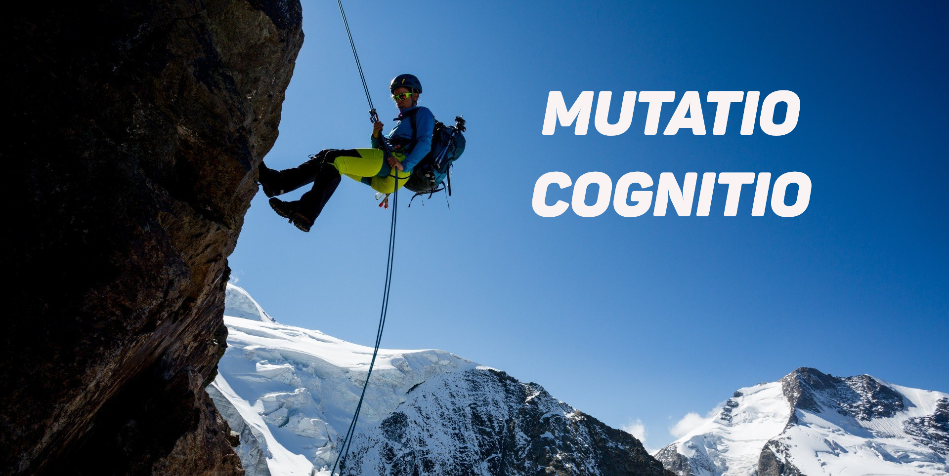 Climber, abseiling down the side of a mountain.