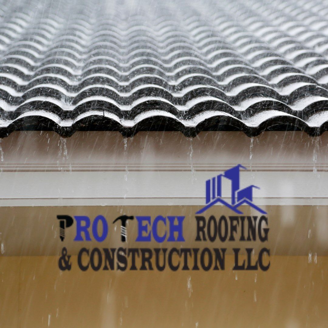 A pro tech roofing and construction llc logo on a building