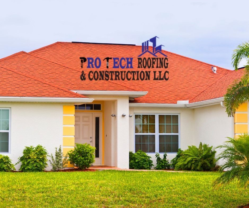 A white house with a red roof is owned by pro tech roofing & construction llc