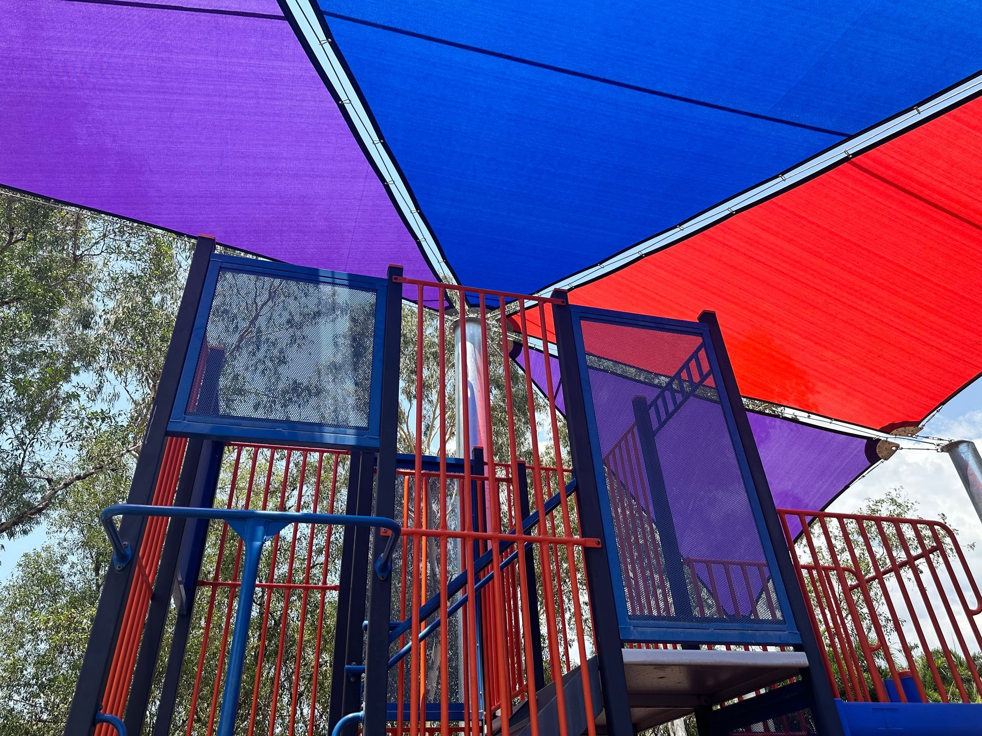 A Blue, Purple and Red Shade Is Covering A Playground — Aerosail Engineered Fabric Structures In Winnellie, NT