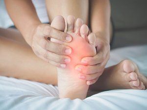 Podiatrist — Women Feeling Pain Her Foot in Marlborough, CT