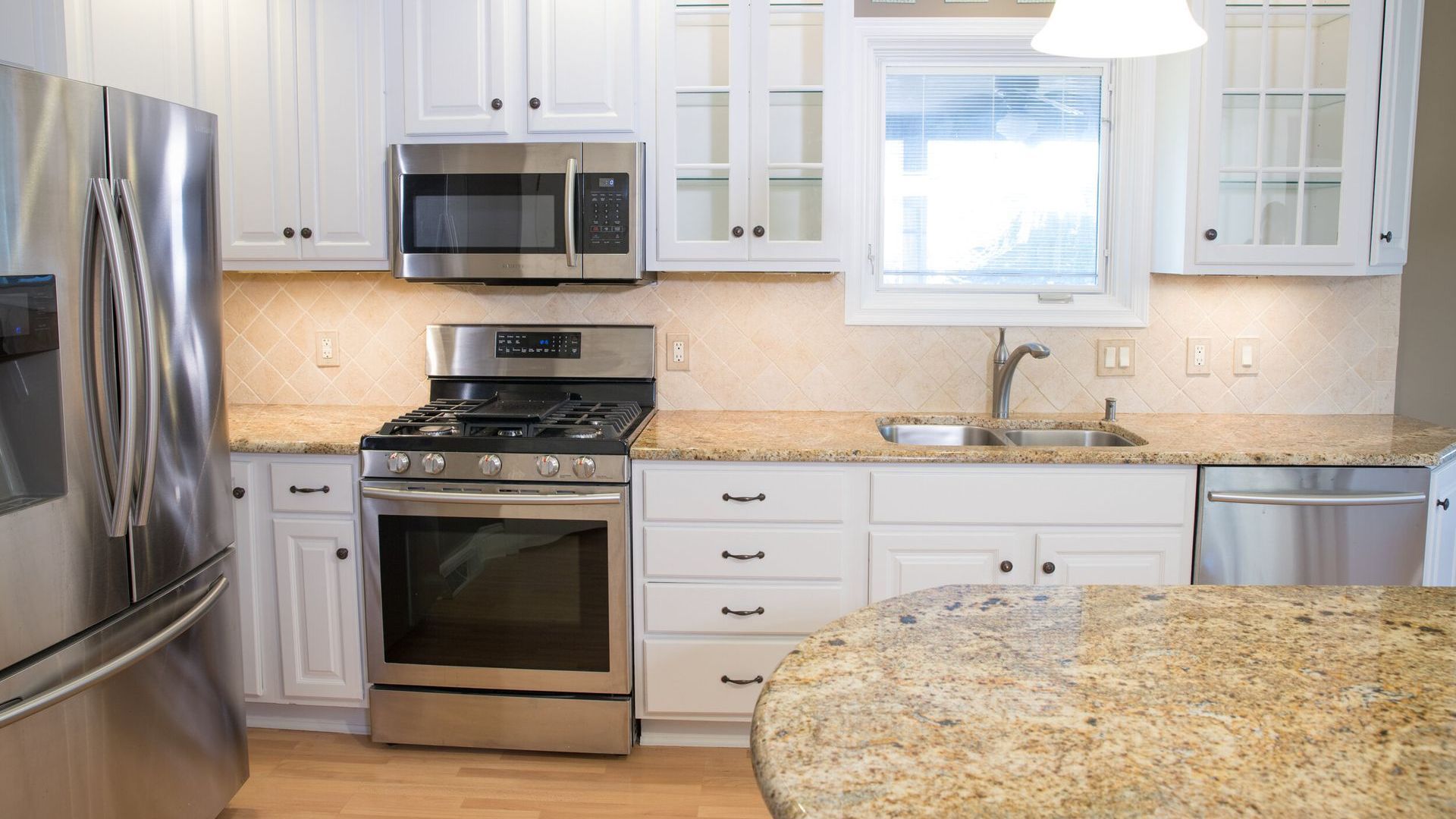 Outdated oak cabinets transformed with modern white paint